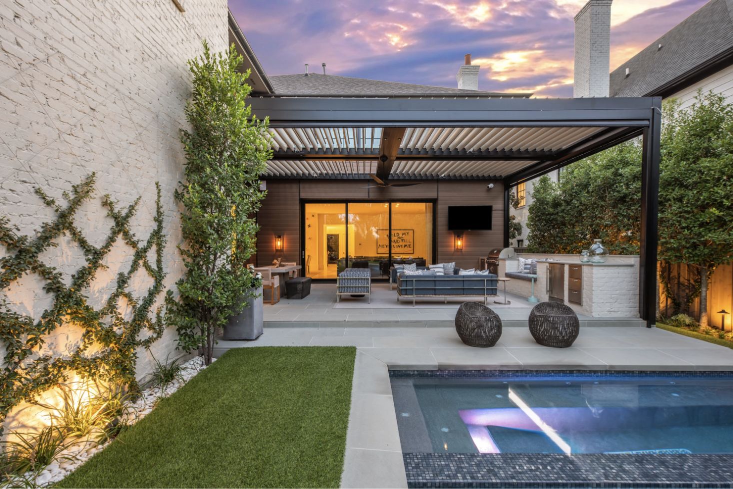 Modern residential patio with lawn patch by Equinox