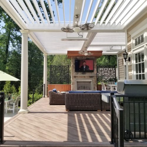 A residential backyard patio featuring a white louvered patio covering by Equinox