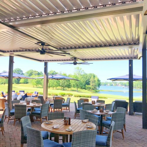  golf course with a large patio covering by Equinox