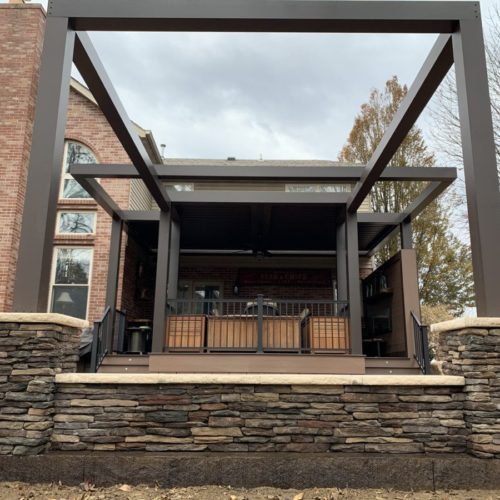 A black louvered patio covering system by equinox