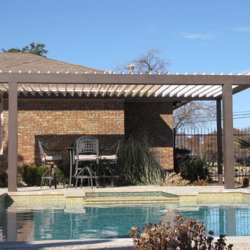 Outdoor open louvered patio covering on an island home 