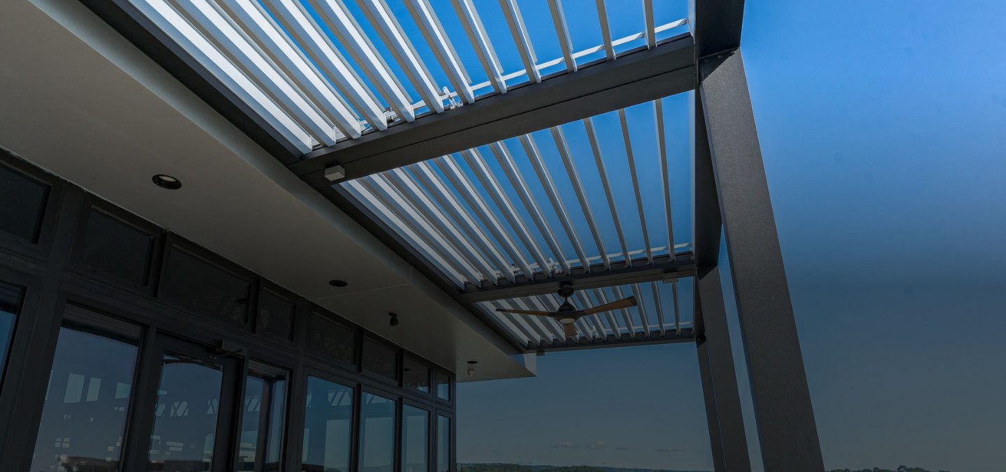 open air louvered roof on a residential building patio cover