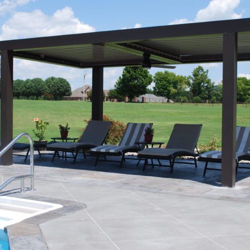 a faux wood pergola shading an outdoor seating area