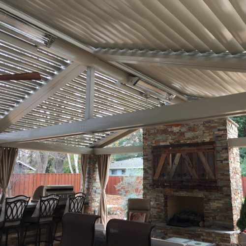 a large gabled roof  covering an outdoor dining area
