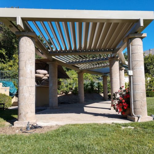 An open louvered roofing solution makes this patio cover modern and stylish.