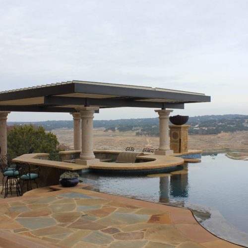 An alternative view of the custom 4 column pergola in a residential backyard. 