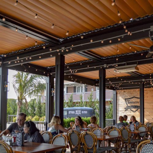 commercial restaurant dining area outdoor patio shaded by equinox patio cover