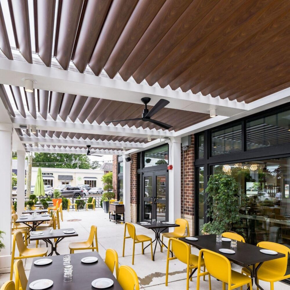 A commercial pergola with motorized louvers.